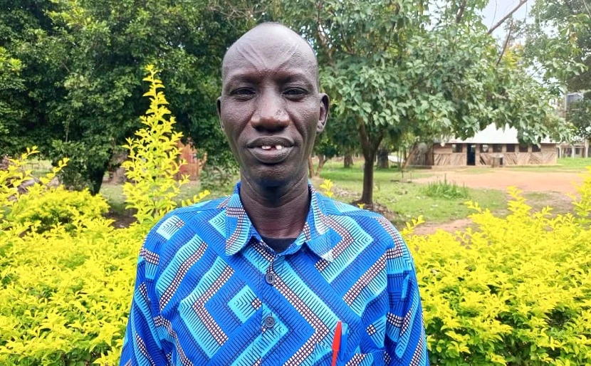 A teacher interacting with children in a classroom